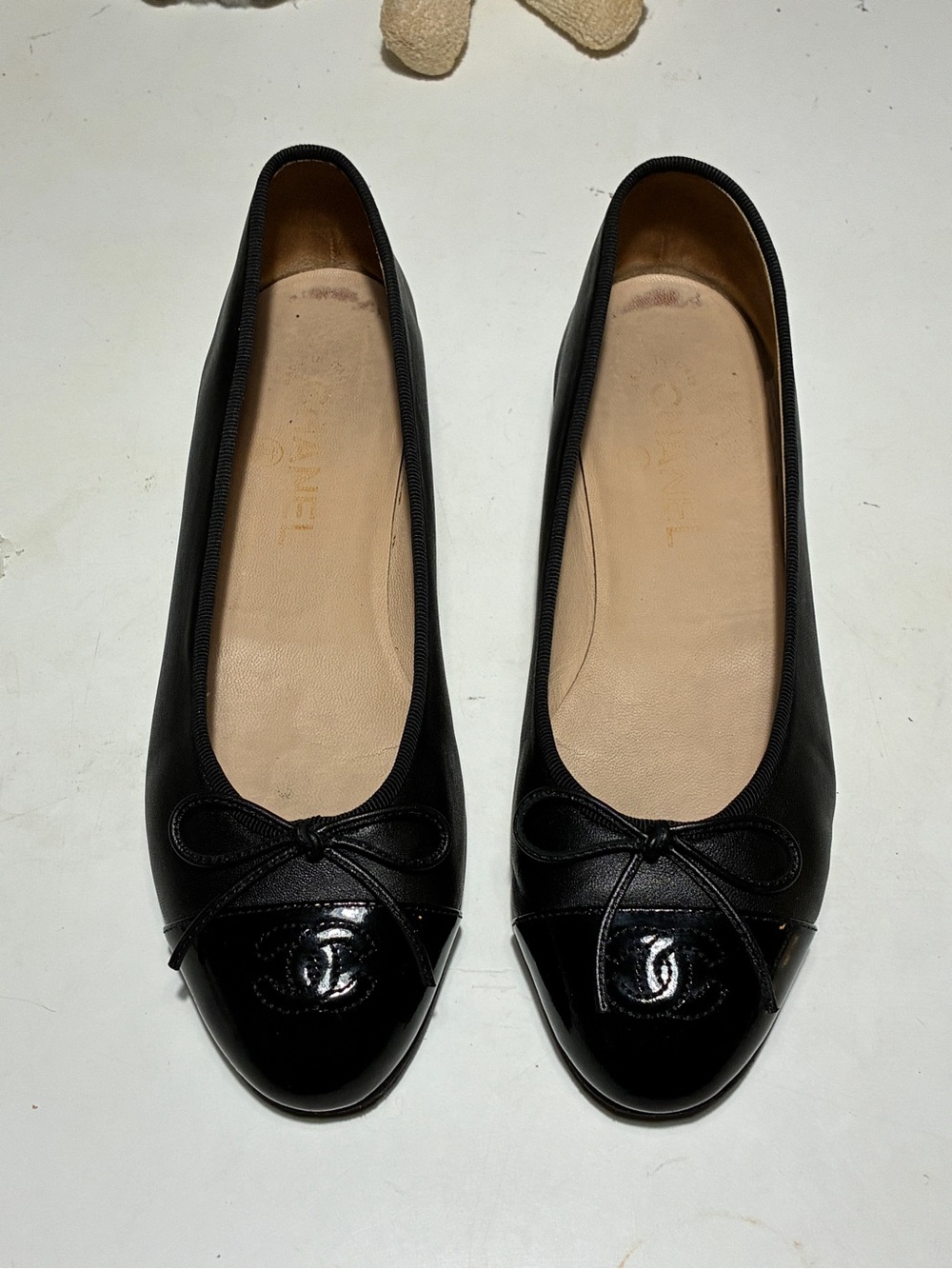 CHANEL Black Leather Cap-Toe Ballet Flats with Bow